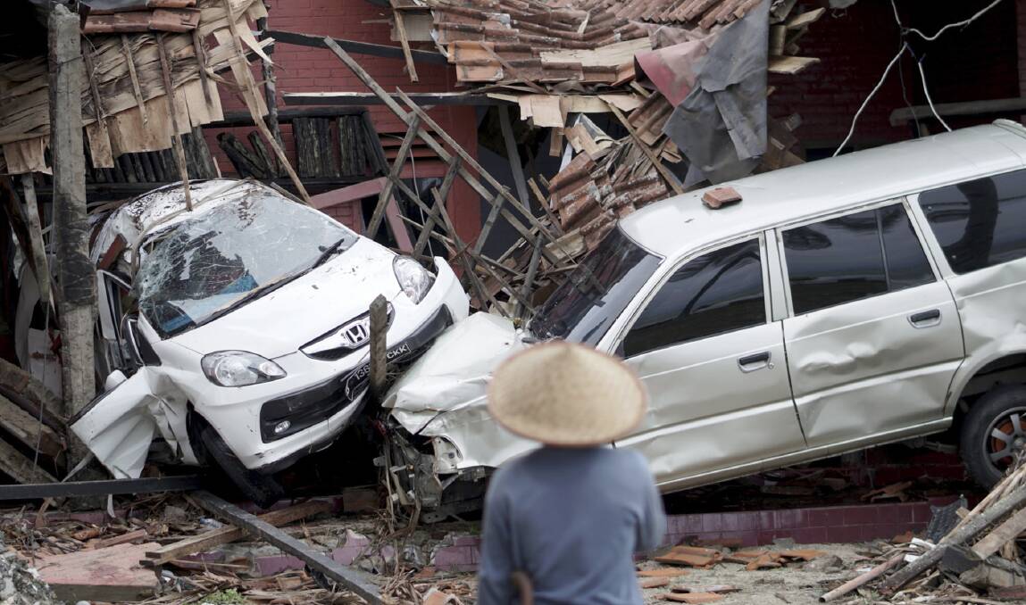 Buildings and vehicles were severely damaged in the disaster.  Photo: EPA