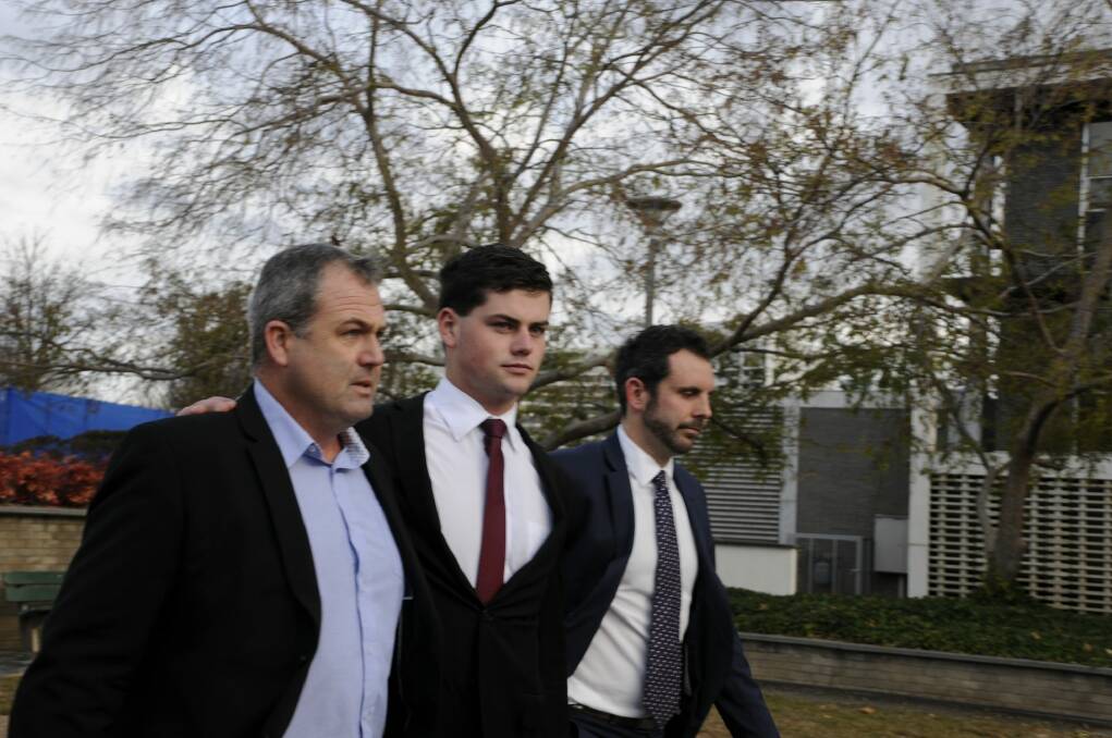 Jack Toby Mitchell (centre) leaves court with his father (left) and solicitor Adrian McKenna. Photo: Alexandra Back
