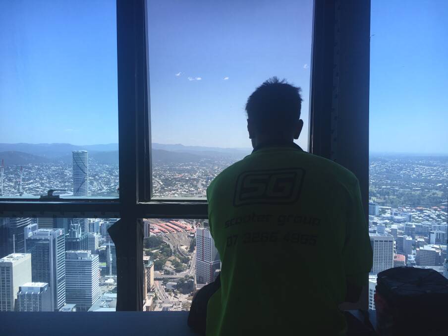 Tradies enjoy the view from their "lunch room" on the upper floors of Brisbane's Skytower.  Photo: Lydia Lynch
