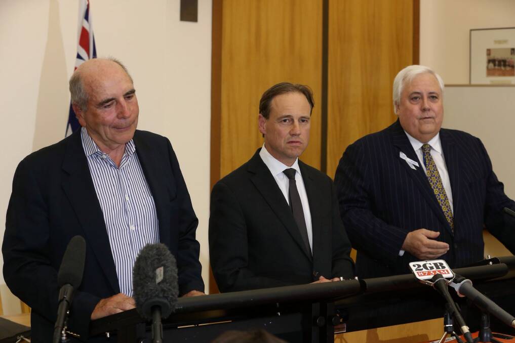 Environment Minister Greg Hunt with Bernie Fraser, left, and Clive Palmer, right.  Photo: Andrew Meares