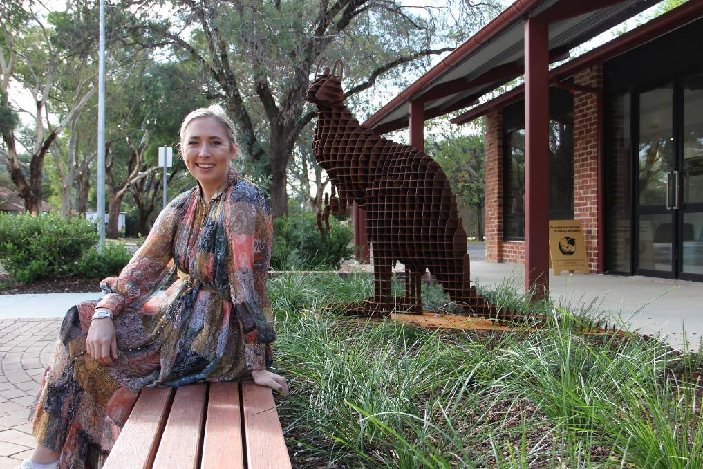 Artist April Pine with Roo Watch, her sculpture installed at the Downer shops on Friday.
 Photo: Supplied