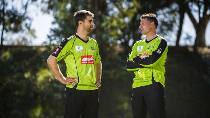 Ryan Carters and Mike Hussey, from the Sydney Thunder, at the University of Canberra following the announcement of a sponsorship deal between the UC and Thunder. Photo: Rohan Thomson