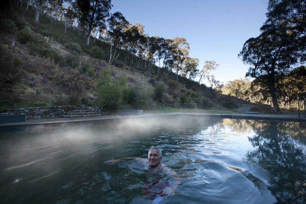 Mist rises off Yarrangobilly's thermal pool at dawn. Photo: Yarrangobilly Caves and Murray Vanderveer