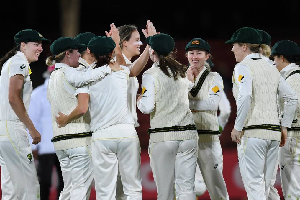 Breakthrough: Ellyse Perry celebrates the wicket of Georgia Elwiss, caught by Megan Schutt.  Photo: AAP