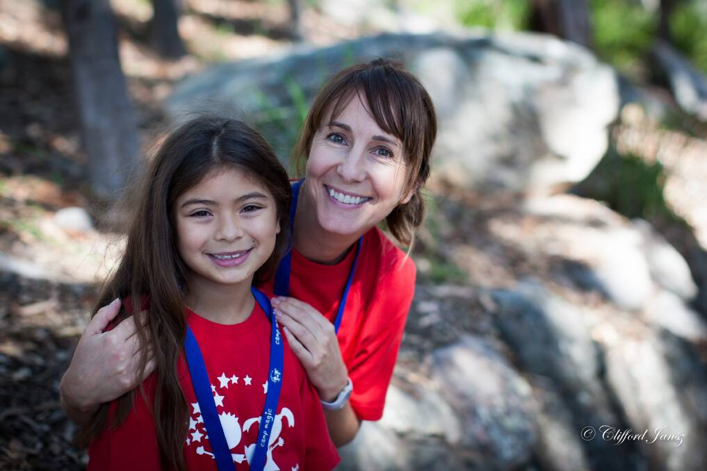 A mentor with a child on a previous Camp Magic for bereaved children. Photo: Supplied