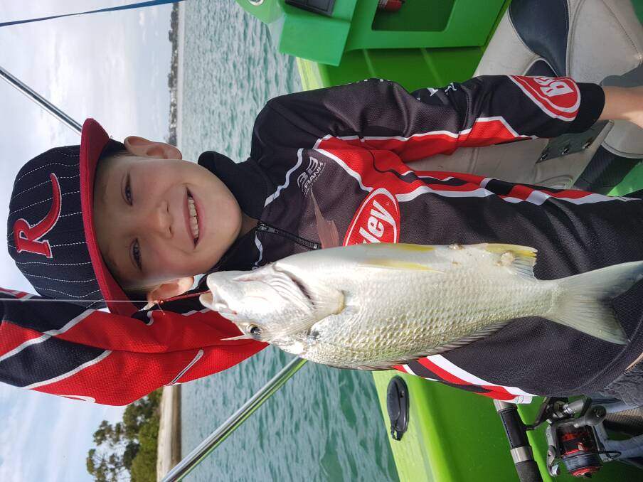 Liam Caddaye, 7, with a lovely little bream caught on bait. Bait fishing is a great way to introduce youngsters to angling. Photo: Ben Caddaye