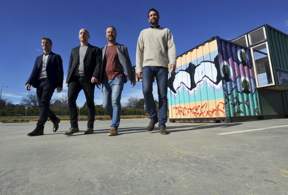 From left, members of the Stomping Ground Collective
on the slab at Westside Acton Park Terry Shaw, Ronan Moss, Alastair Evans and Chris Warner. The slab will be transformed into a pop-up city of shipping containers with food and retail shops.23rd. July 2014 
 Photo: Graham Tidy.
