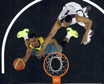 Patrick Mills goes in for a lay-up past Russell Westbrook of the USA. Photo: MIKE SEGAR