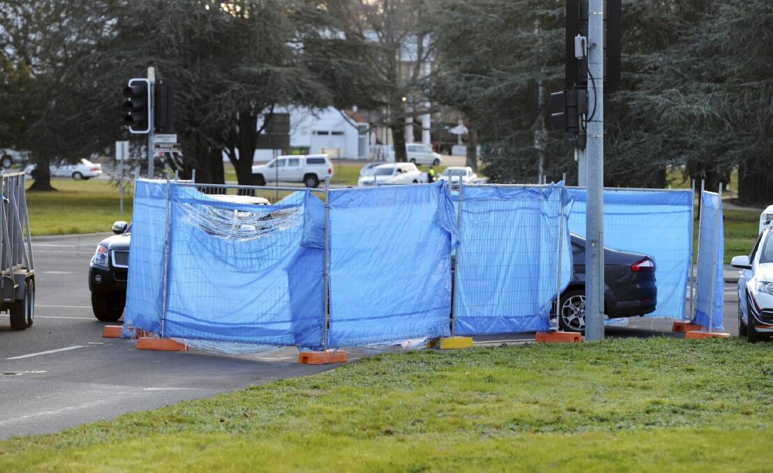 Investigation: Police erected barriers at the site of the accident. Photo: Graham Tidy