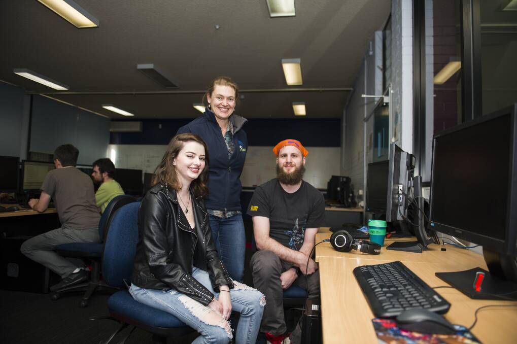 The Canberra Technology Park will be sold off to the Academy of Interactive Education for a redevelopment. AIE student Sian Sallway, AIE planning and implementation manager Casey Gregory, and AIE student Pop Jadric.  Photo: Dion Georgopoulos