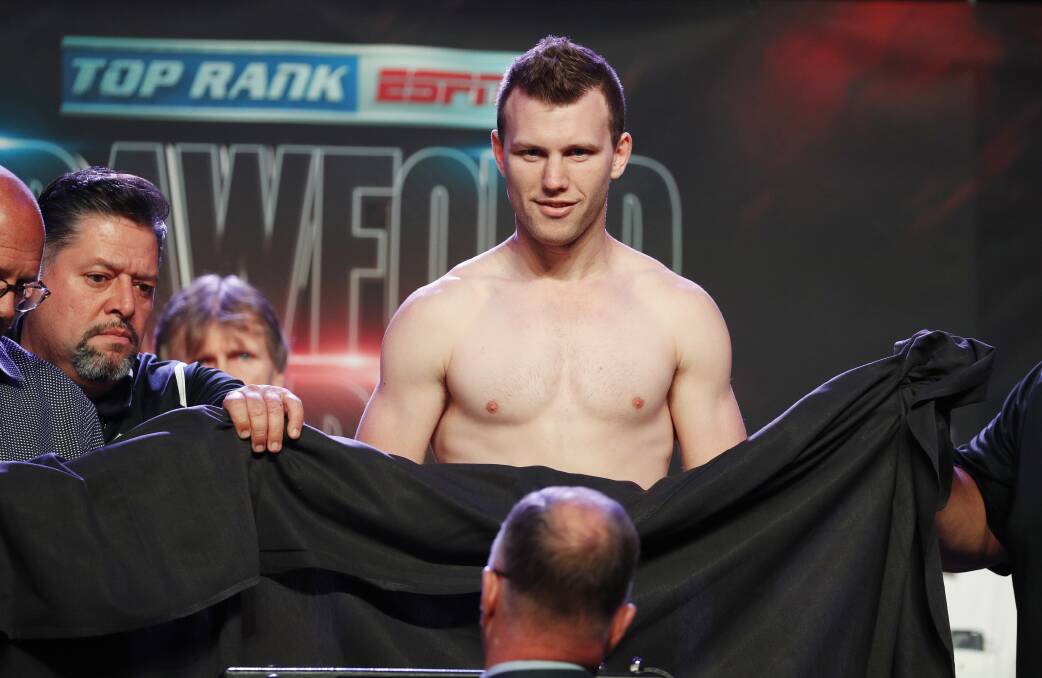 Modesty: A sheet had to cover up Horn after he was forced to take off his underwear while trying to make weight. Photo: AP