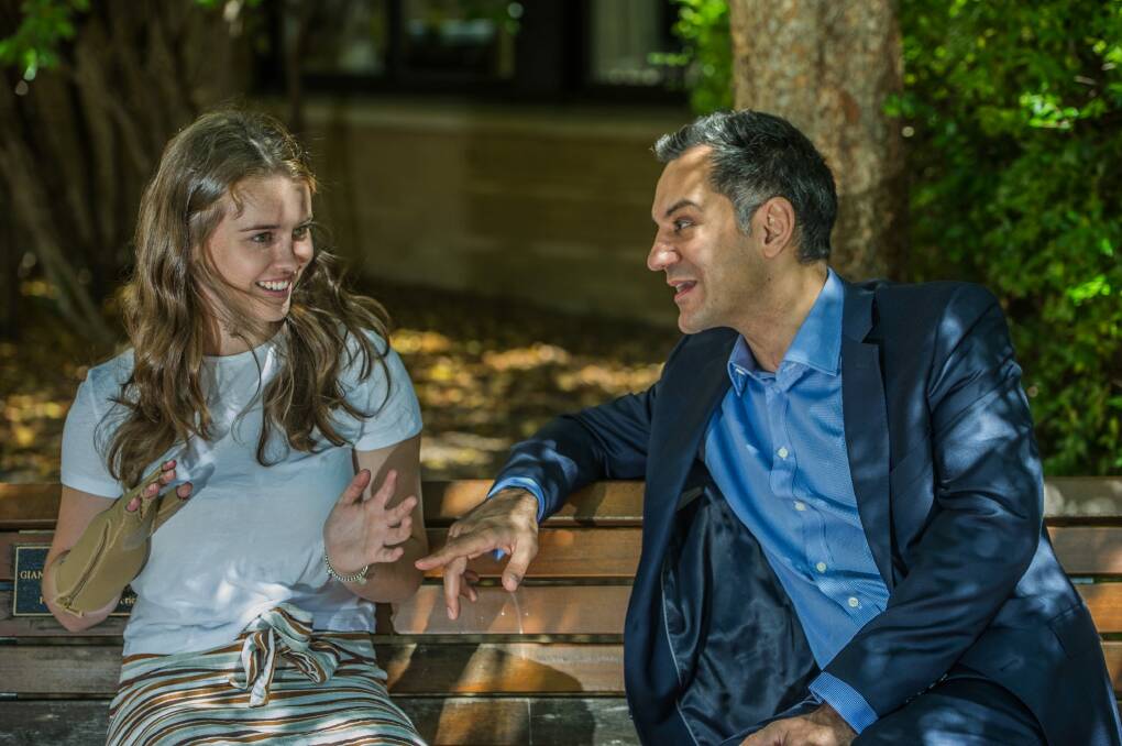 There is an obvious rapport between Canberra plastic surgeon Dr Ross Farhadieh and his young patient Sarah Hazell who today can use her re-attached right hand to write, drive, swim, eat with. Photo: Karleen Minney