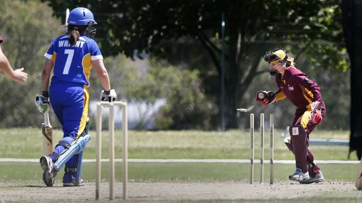 ACT batter Laura Wright is run out by Queensland wicket keeper Jodie Fields. Photo: Jeffrey Chan