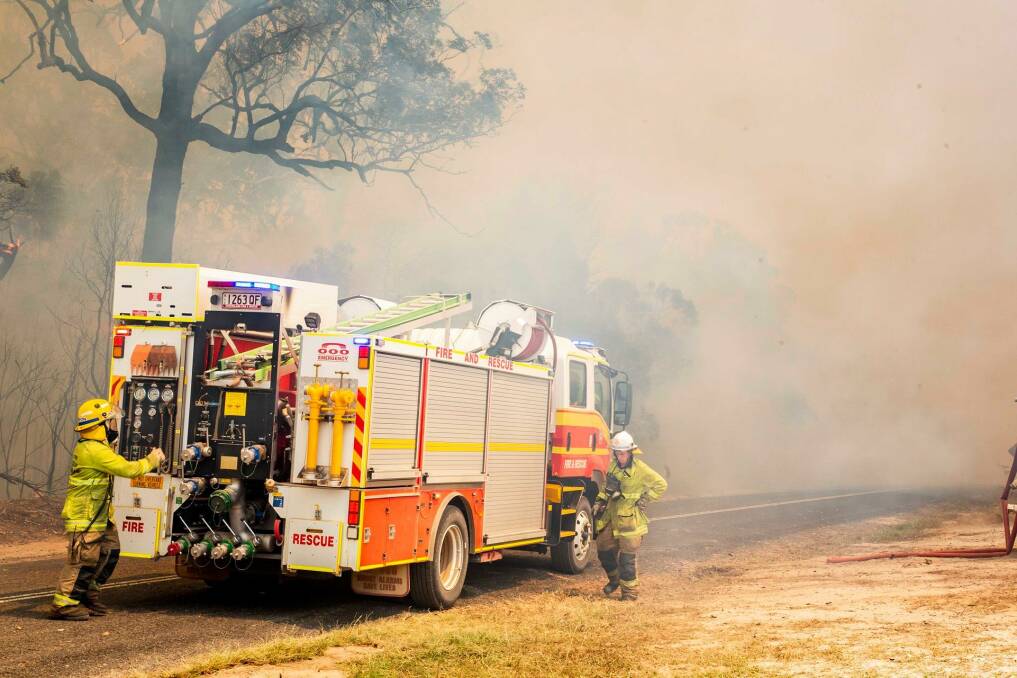 Firefighters working to control a bushfire in Deepwater, central Queensland. Photo: QFES Media.