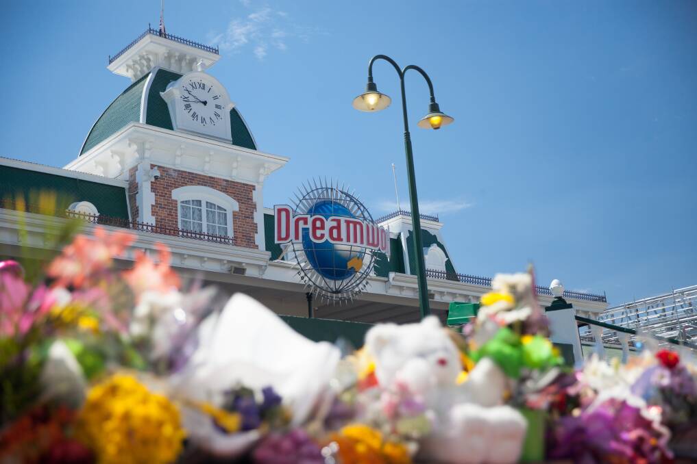 People laid tributes at Dreamworld after the tragedy in 2016.   Photo: Tammy Law