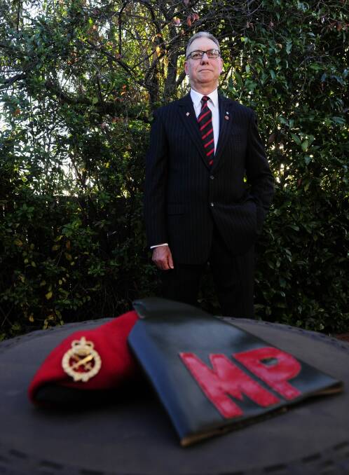 Former military policeman, Lieutenant Colonel Kas Paul of Gordon with his military police field shoulder brassard and beret.  Photo: Melissa Adams 