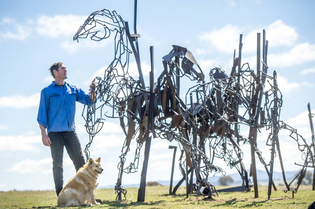 Chairman of the Sculpture in the Paddock committee Duncan Waugh with Harrie Fasher's <i>The Last Charge.</i> Photo: Karleen Minney