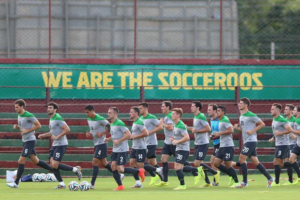 Socceroo players warm up during a training session in in Vitoria, Brazil.   Photo: Cameron Spencer