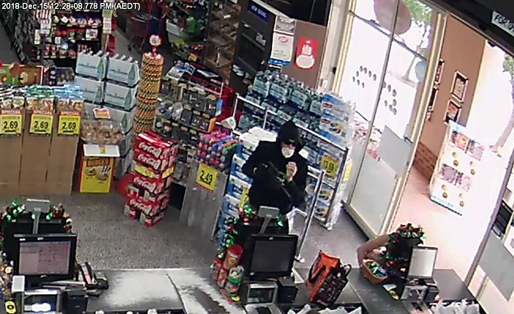ACT Policing is looking for witnesses after a man (pictured) threatened customers and stole cash from a Nicholls supermarket on Saturday. Photo: ACT Policing