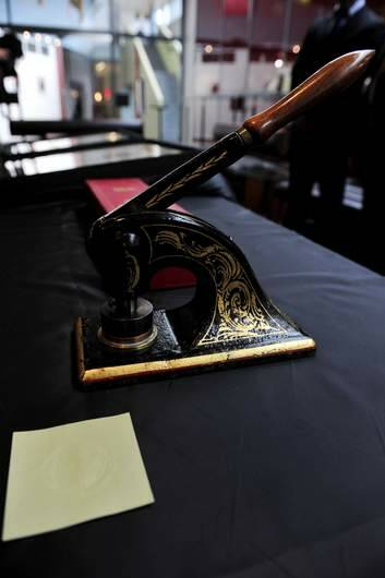 The document and seal of the Canberra Coat of Arms. Photo: Jay Cronan