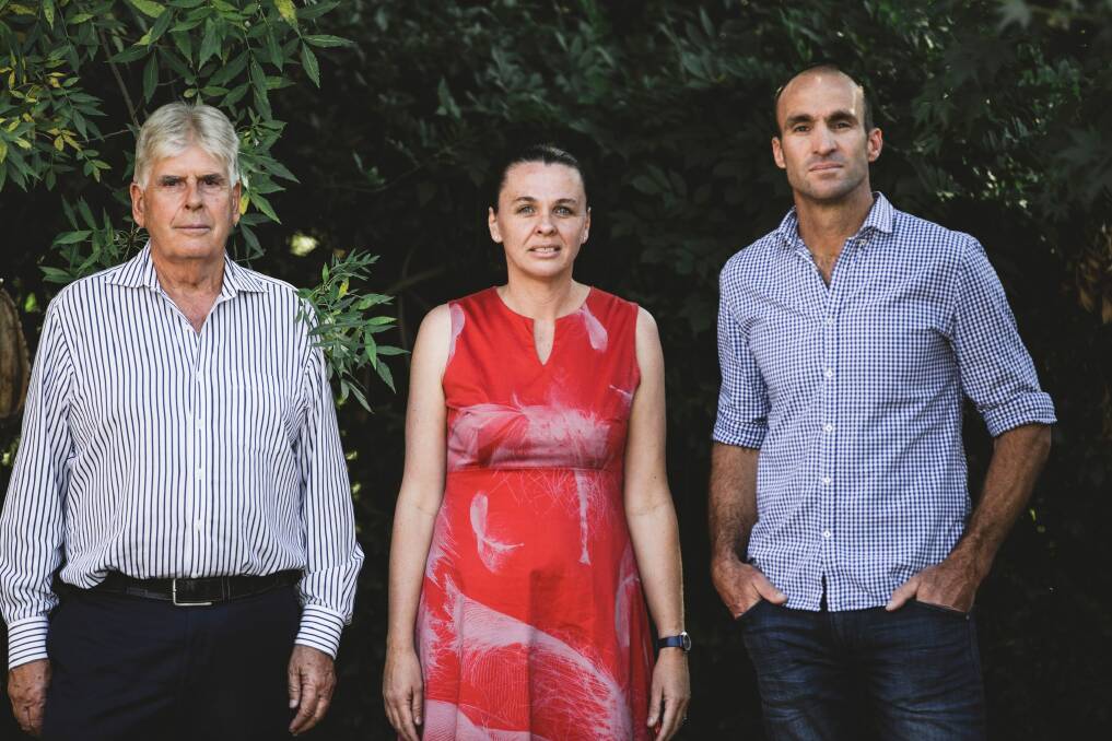 Jim Bain, Natasha Knowles and Mark Taylor, who all bought blocks in Forrest with a view to developing them one day, say the NCA's new proposal will shave value off their properties.  Photo: Jamila Toderas