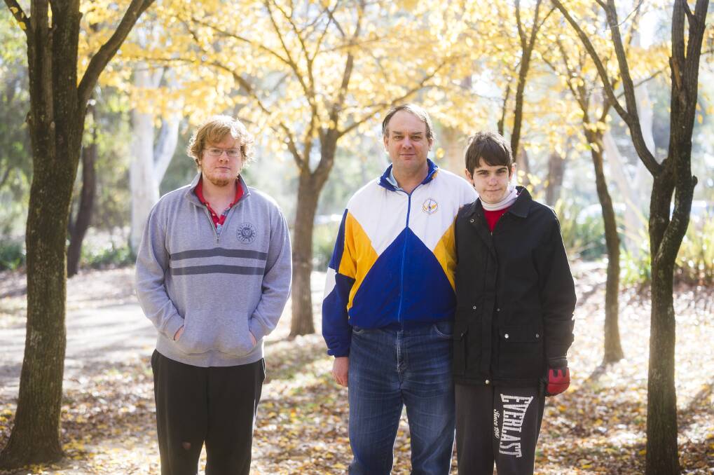 John Donovan (centre) and his two sons Nicholas (L) and Cameron (R) may struggle under potential changes to the NDIS. Photo: Dion Georgopoulos