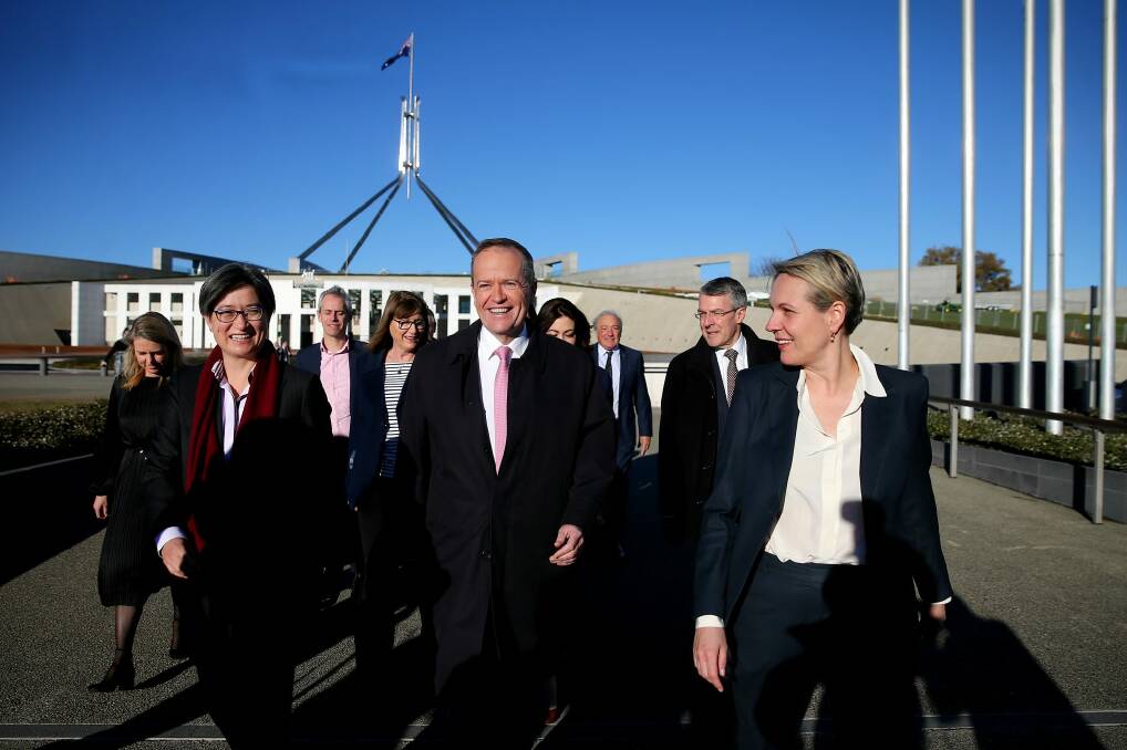 Senior Labor figures, including Senator Penny Wong, Opposition Leader Bill Shorten and Deputy Opposition Leader Tanya Plibersek arrive at a 'Sea of Hearts' event in support of marriage equality on the front lawn of Parliament House on Tuesday. Photo: Alex Ellinghausen