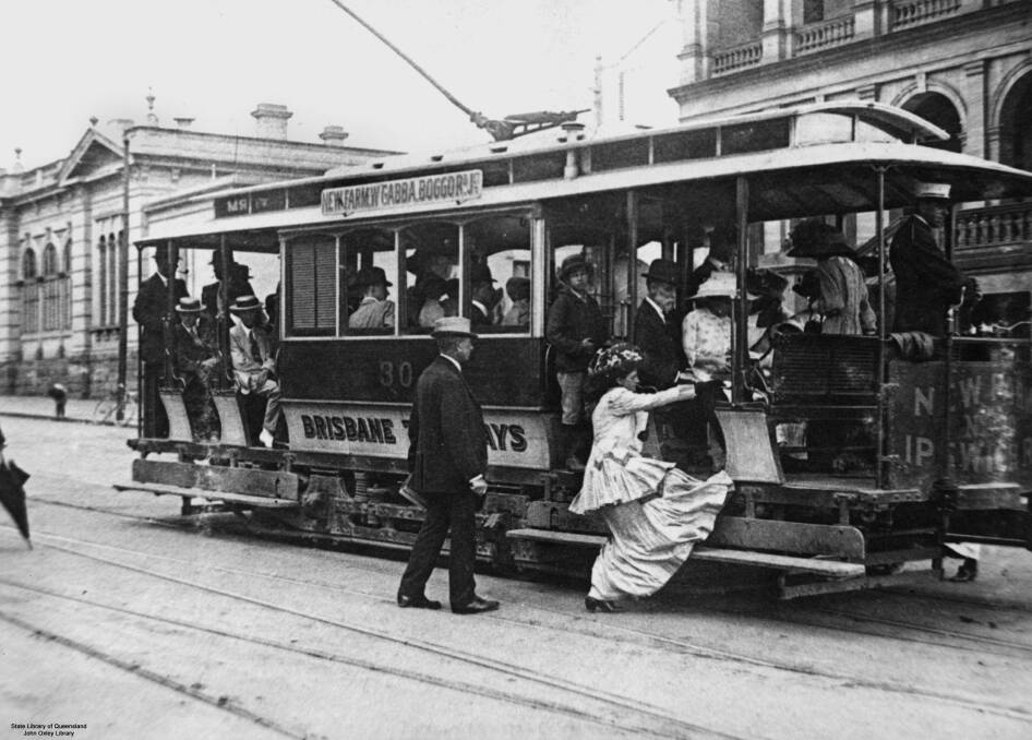 Woman getting on a tram, Brisbane, 1910-1920. Photo: John Oxley Library - State Library of Queensland