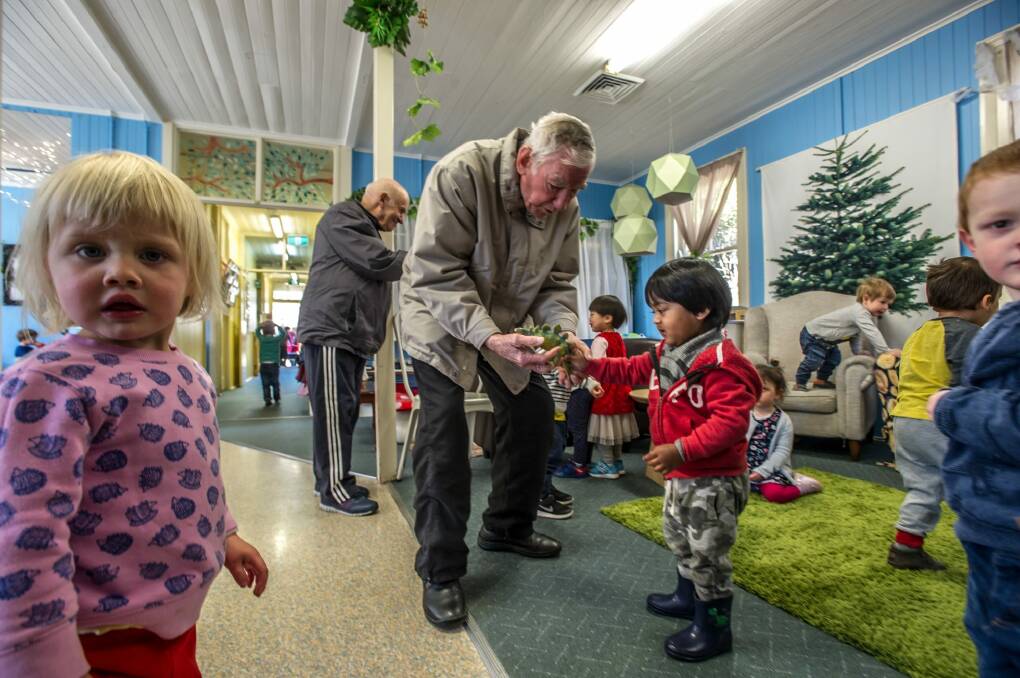 Lloyd Hone gets to play dinosaurs with the children. Photo: Karleen Minney