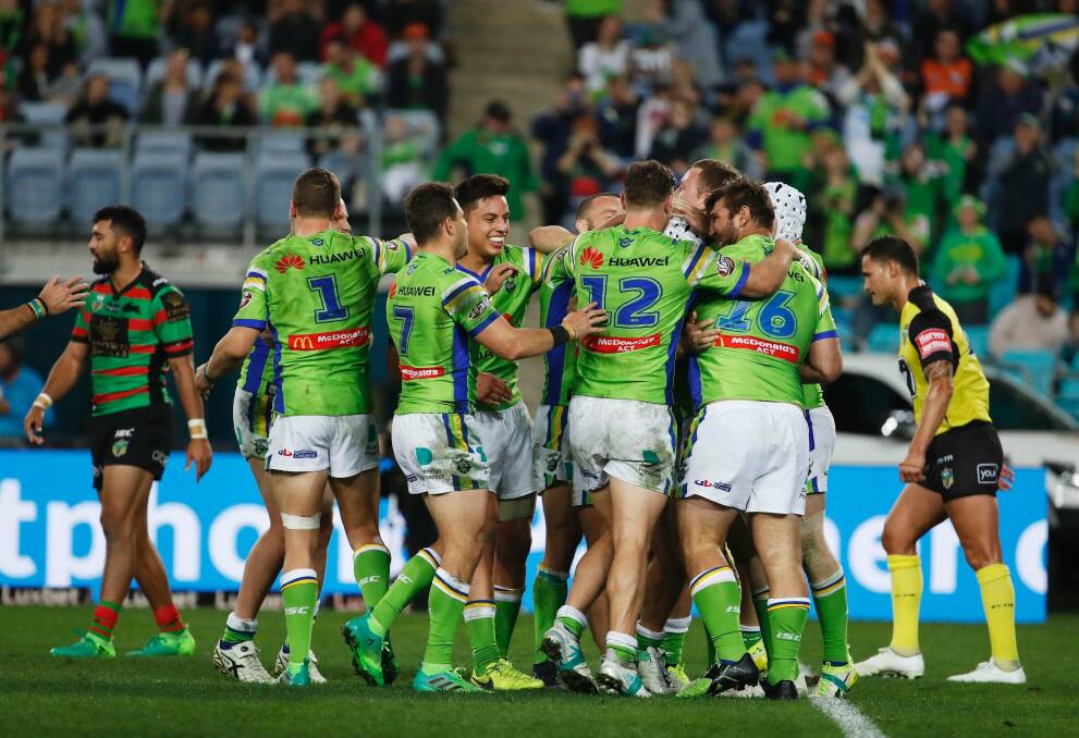 The Raiders celebrate after scoring a try. Photo: AAP