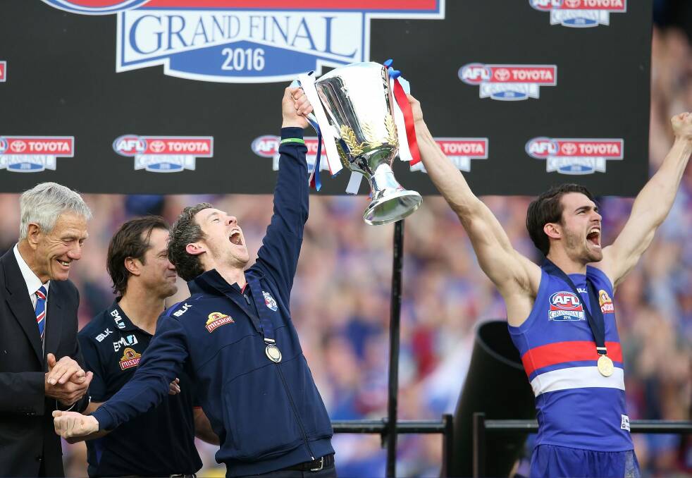 Easton Wood (right) and Bob Murphy lift the club's first premiership trophy in more than six decades. Photo: Scott Barbour