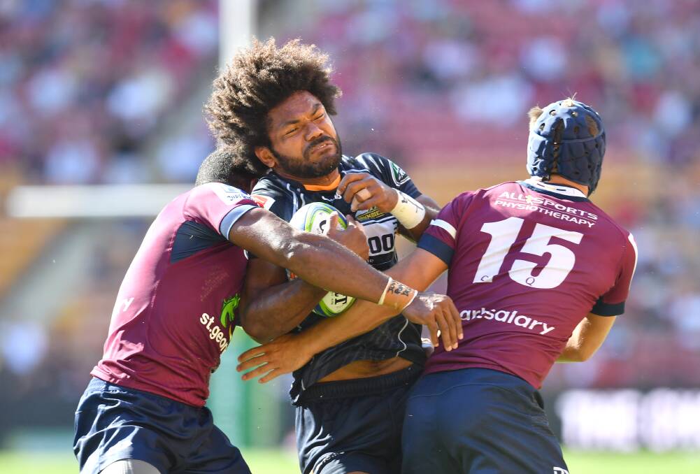 Brumbies winger Henry Speight running into heavy traffic.  Photo: AAP
