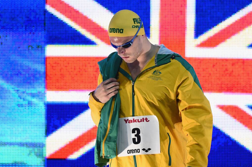 Focused: Kyle Chalmers walks onto the pool deck before winning the men's 100m freestyle final at the Pan Pacs. Photo: AAP