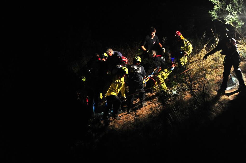 ACT Fire and Rescue crews work to rescue a 17-year-old boy at Ginninderra Falls.  Photo: Melissa Adams 