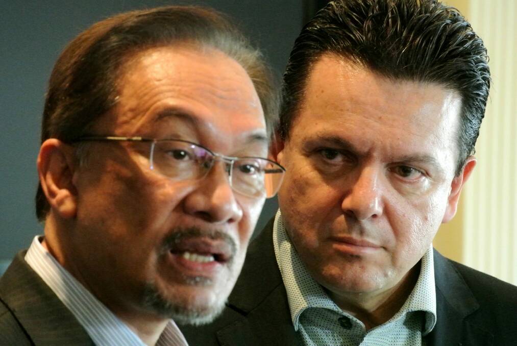 Malaysian opposition leader Anwar Ibrahim, left, with senator Nick Xenophon in Jakarta in 2014. Photo: Michael Bachelard