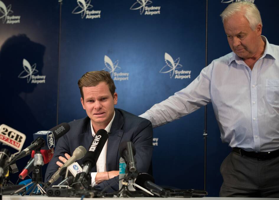 Former Australian cricket captain Steve Smith, flanked by his father Peter, weeps as he addresses media in March after the ball-tampering scandal. Photo: Janie Barrett