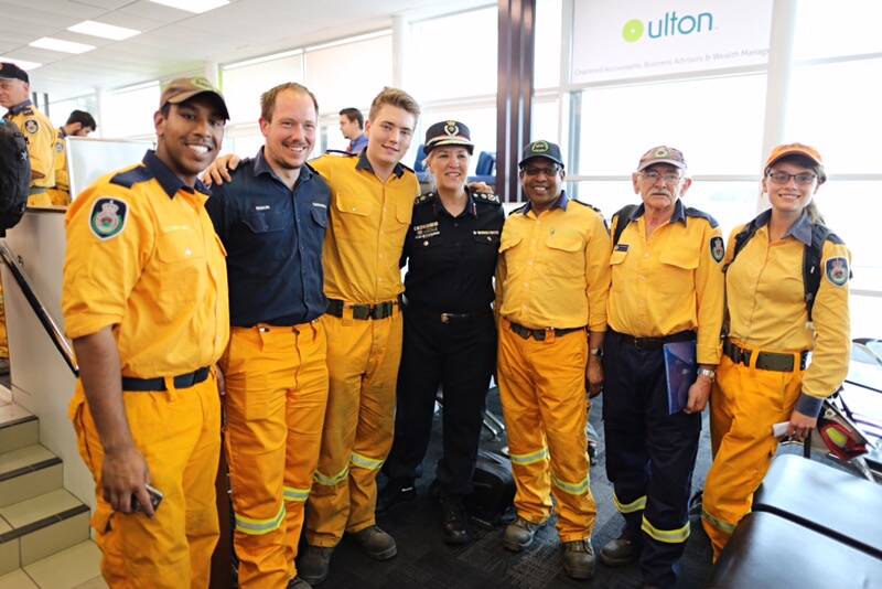 QFES Fire Commissioner Katarina Carroll and New South Wales firefighters who have helped with the efforts in Queensland this week. Photo: Jack Tran/ Office of the Premier