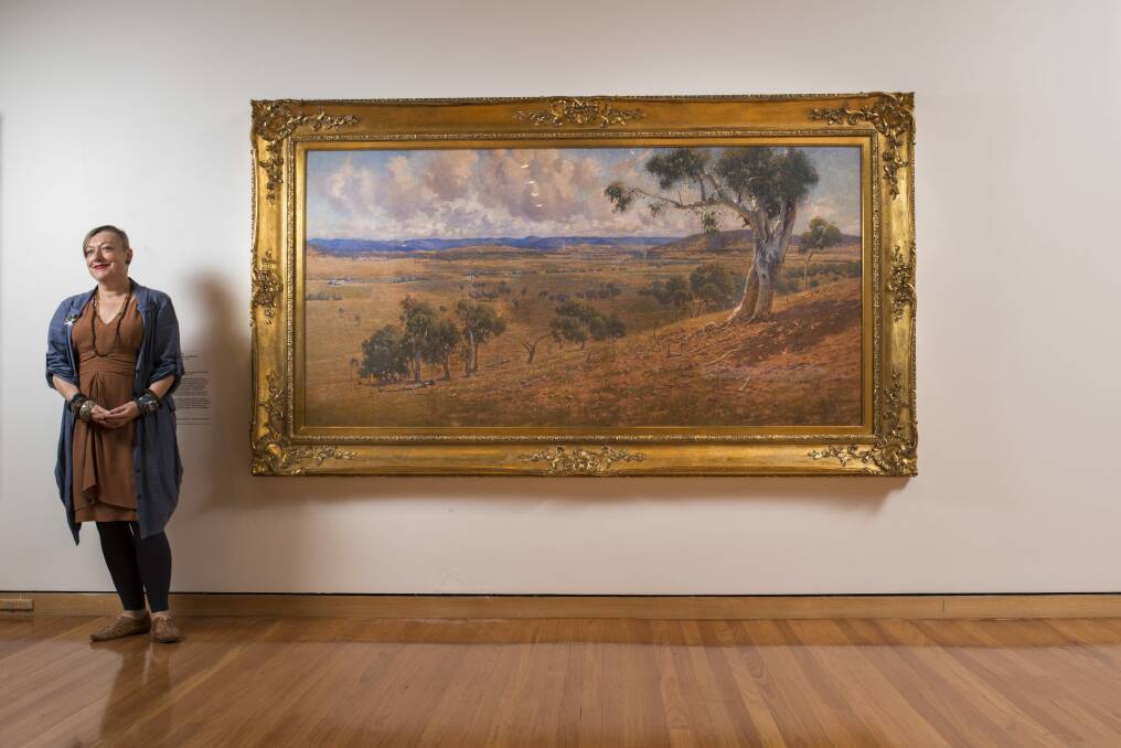 CMAG curator Deborah Clark with W Lister Lister's 'Federal Capital site', of 1913 Canberra. Photo: Rohan Thomson