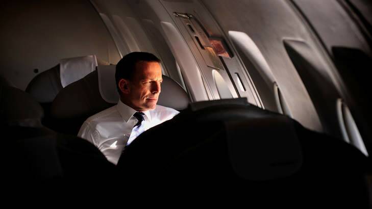 This photo, used in a campaign ad, shows Tony Abbott on the campaign trail flying from Melbourne to Sydney on a private plane. Photo: Jason South/Fairfaxphotos