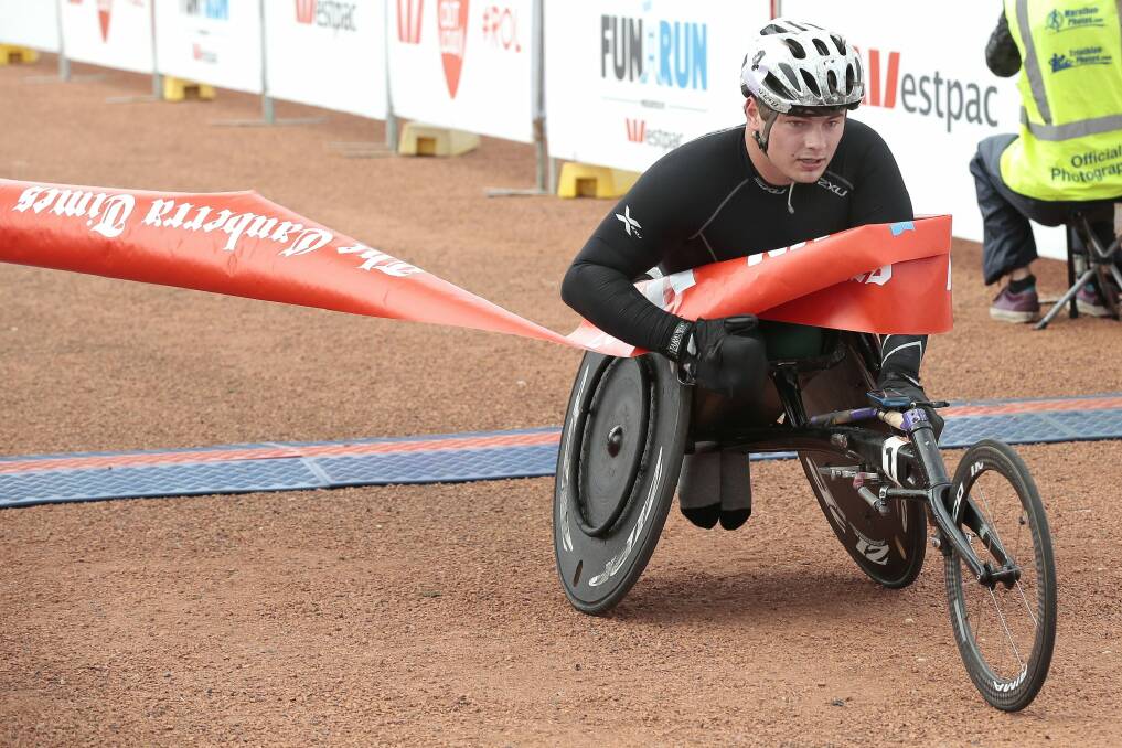 Adelaide's Nathan Arkley geared up for Rio next year by winning the 14km wheelchair race Photo: Jeffrey Chan