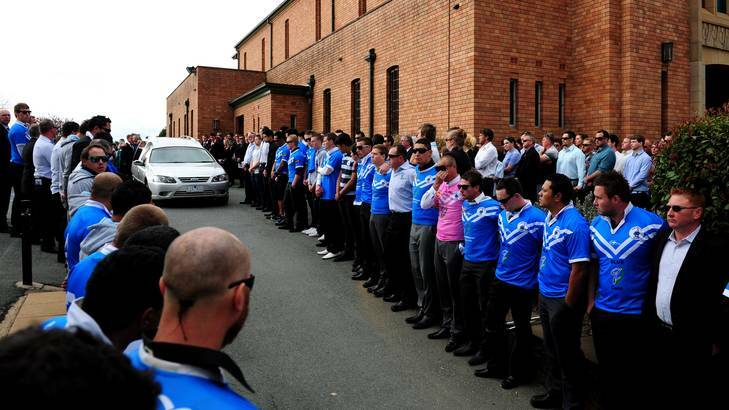 Jay Lasscock's teammates and friends form a guard of honour at the Queanbeyan Blues skipper's funeral. Photo: Melissa Adams