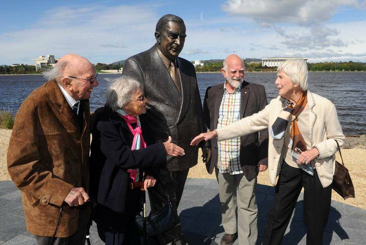 Sir Robert Menzies' daughter Heather Henderson and artist Peter Corlett with Sir Richard and Lady Kingsland, at left, at the Sir Robert Menzies sculpture unveiling in Commonwealth Park. Picture: Richard Briggs