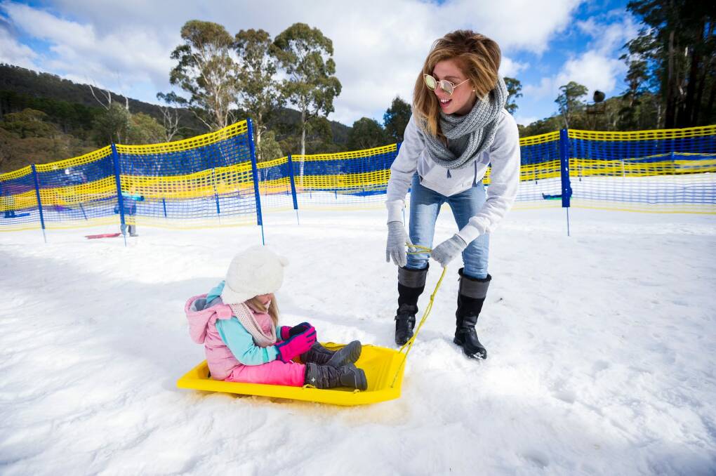 Sarah Vennell and Maia, 3, enjoy the snow. Photo: Dion Georgopoulos