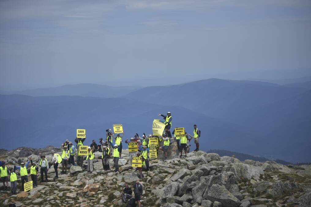 A group of protesters from Save Kosci reach the top of Mount Kosciuszko on Saturday, December 8 to protest against wild horses in the park. Photo: Finbar O'Mallon