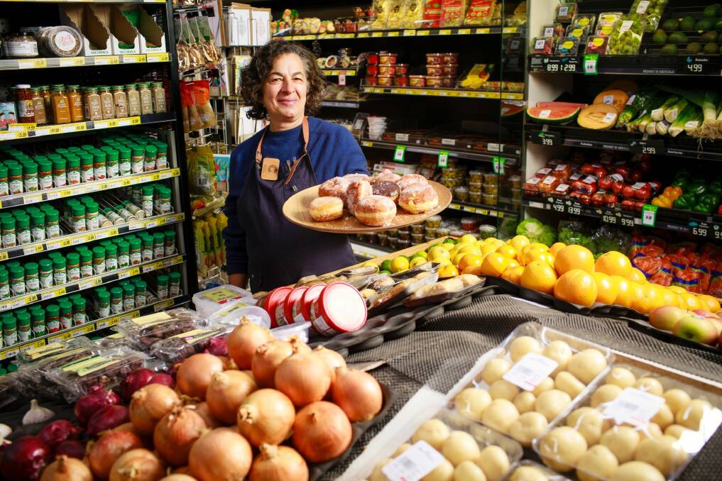 Marie-Anne Raad at The Cook Grocer, which is leading the celebrations for the suburb's 50th birthday. Photo: Sitthixay Ditthavong