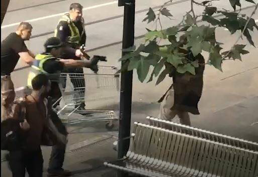 A witness tried to help police by ramming the suspect with a shopping trolley. Photo: Supplied