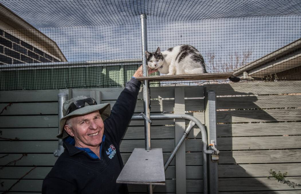 Thomas Graham, who helps install cat containment spaces around Canberra. Photo: Karleen Minney