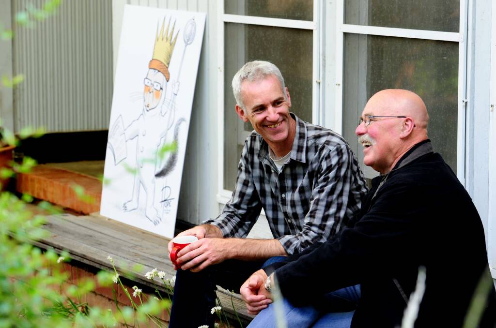 David Pope chats with former Canberra Times cartoonist Geoff Pryor. Photo: Melissa Adams