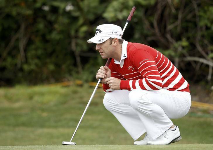 Canberra's Brendan Jones lines up his putt on the first green during the first round for the US Open at the Olympic Club in San Francisco. Photo: JEFF HAYNES