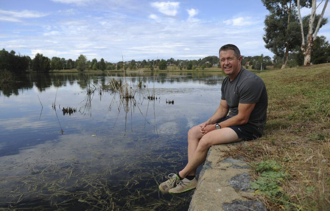 Neil Maher has received a bravery award for his part in saving two girls from swift-flowing water at Yerrabi Pond near his home in October 2012.
 Photo: Graham Tidy